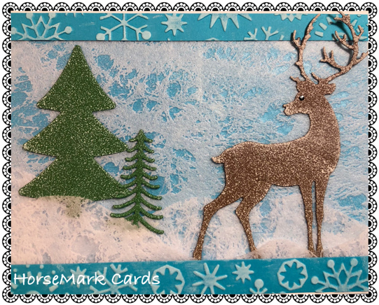 Holiday card created by HorseMark Cards with deer, trees , snowflakes, and fabric paper